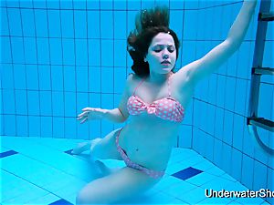 gorgeous girl flashes cool figure underwater