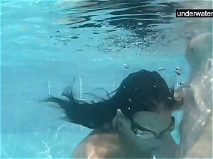 submerged underwater with a trouser snake inside her